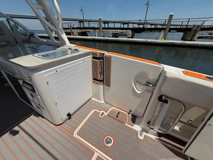  Yacht Photos Pics 2019 Boston Whaler 320 Vantage boat interior with sleek design and dockside view.