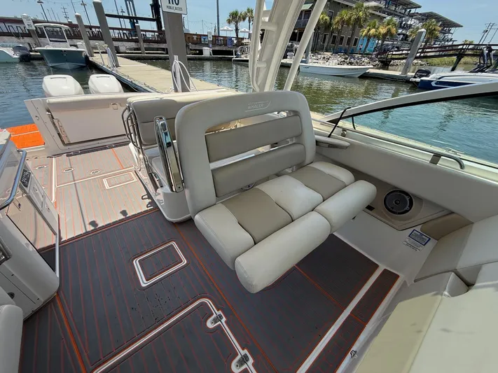  Yacht Photos Pics 2019 Boston Whaler 320 Vantage interior with seating and dock view.