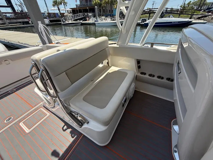  Yacht Photos Pics 2019 Boston Whaler 320 Vantage interior seating area with dockside view.