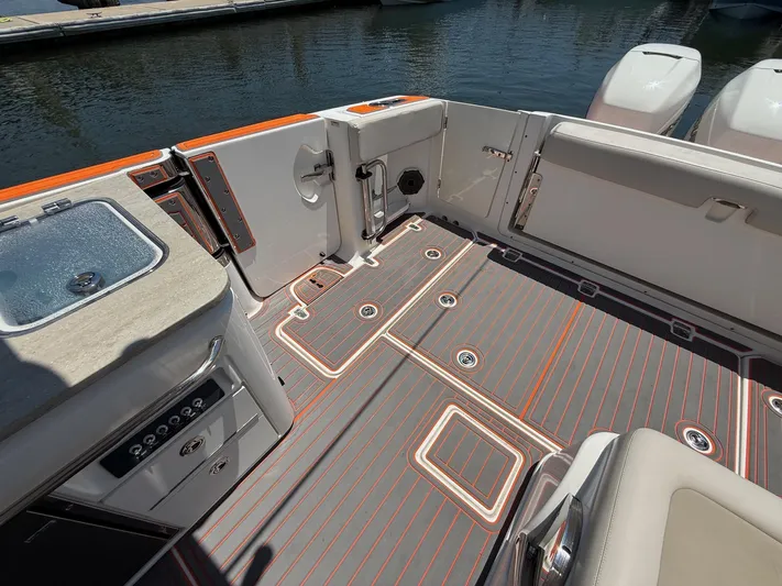  Yacht Photos Pics 2019 Boston Whaler 320 Vantage boat interior with sleek deck design and modern amenities.