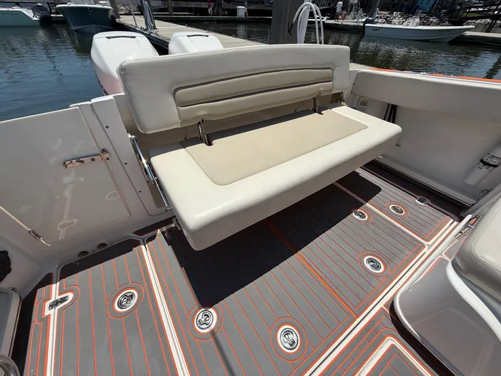  Yacht Photos Pics 2019 Boston Whaler 320 Vantage boat interior with foldable seat and stylish flooring.