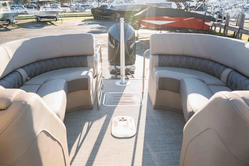  Yacht Photos Pics 2023 Bennington R25 FBAST pontoon boat interior with plush seating and Mercury engine.