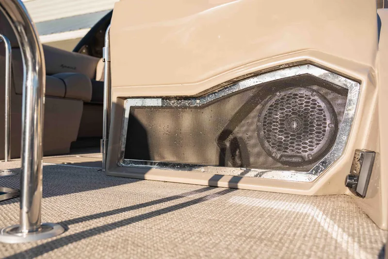  Yacht Photos Pics 2023 Bennington R25 FBAST boat interior with speaker detail and beige upholstery.