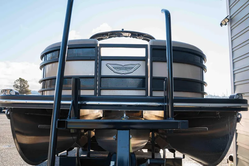  Yacht Photos Pics 2023 Bennington R25 FBAST pontoon boat on trailer, rear view.