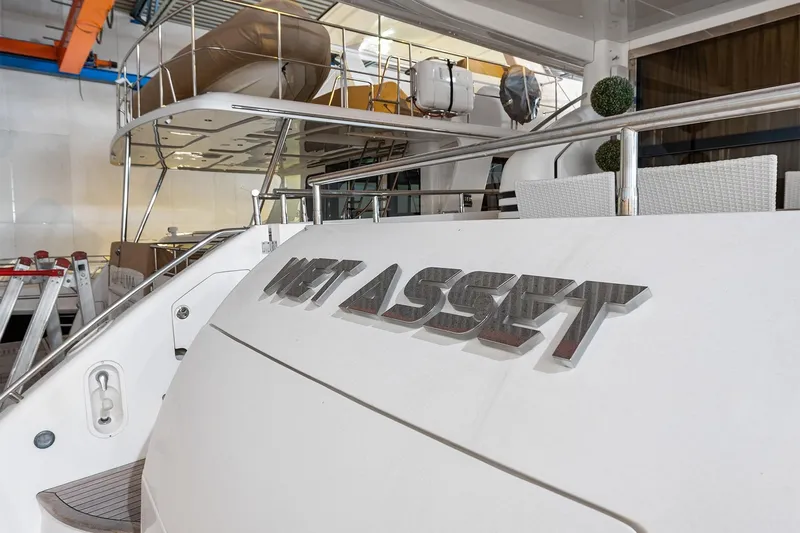  Yacht Photos Pics 2003 Princess 23m yacht in dock, featuring "Wet Asset" nameplate.