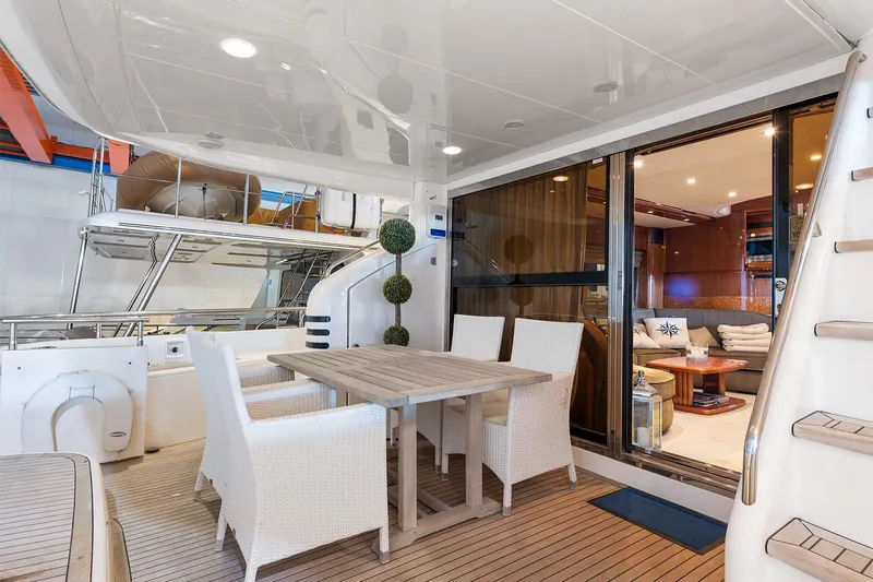  Yacht Photos Pics Luxurious 2003 Princess 23m yacht with elegant outdoor dining area and stylish interior.