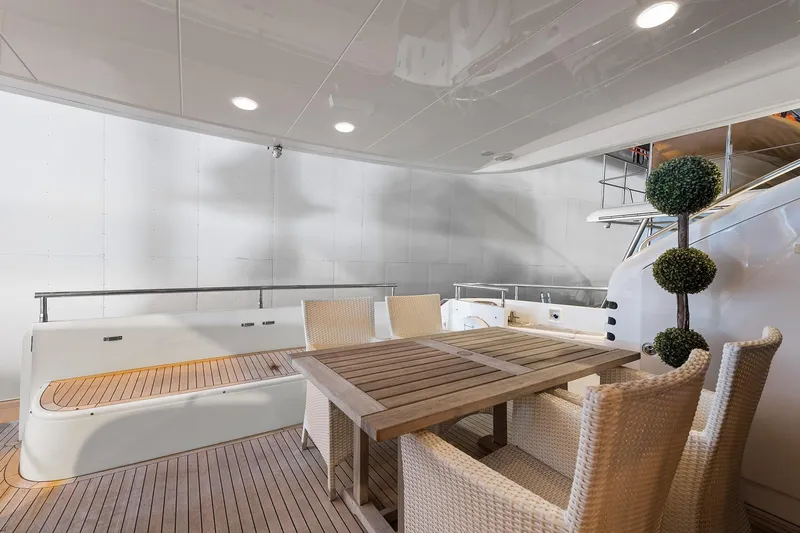  Yacht Photos Pics Luxurious 2003 Princess 23m yacht deck with elegant seating and dining area.