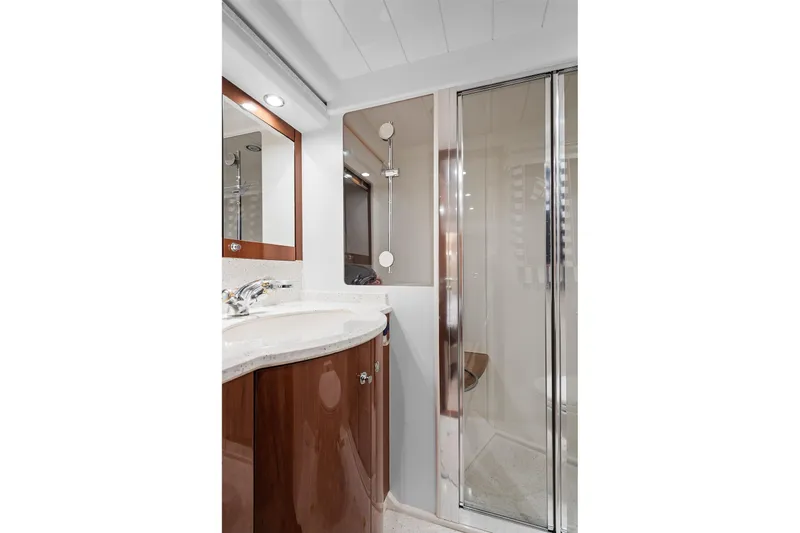  Yacht Photos Pics Luxurious yacht bathroom with modern shower and elegant wood cabinetry, Princess 23m, 2003 model.