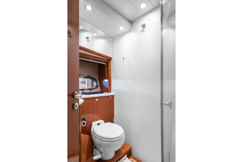  Yacht Photos Pics Luxurious yacht bathroom with modern fixtures, wooden accents, and elegant lighting, Princess 23m, 2003.