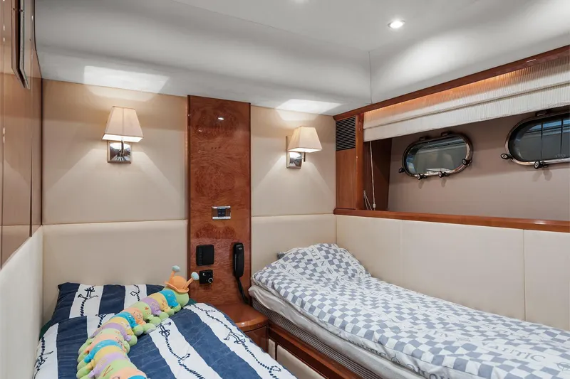  Yacht Photos Pics Luxurious 2003 Princess 23m yacht cabin with twin beds and elegant decor.