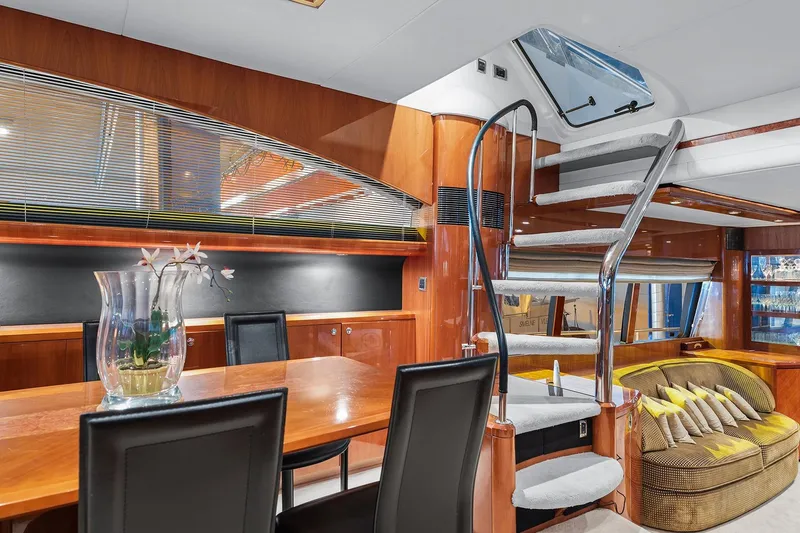  Yacht Photos Pics Luxurious interior of 2003 Princess 23m yacht with elegant staircase and modern furnishings.