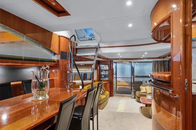  Yacht Photos Pics Luxurious interior of a 2003 Princess 23m yacht with elegant wood finishes and modern design.