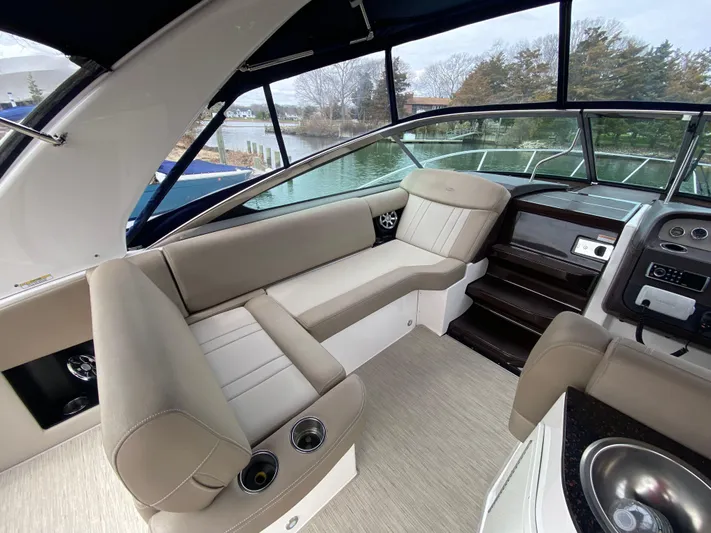  Yacht Photos Pics Luxurious interior of a 2015 Regal 32 Express boat with beige seating and modern amenities.