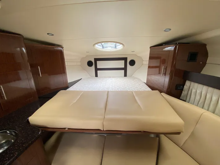  Yacht Photos Pics Interior of 2015 Regal 32 Express yacht with bed and seating area.