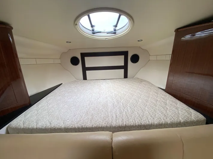  Yacht Photos Pics 2015 Regal 32 Express cabin interior with bed and skylight.