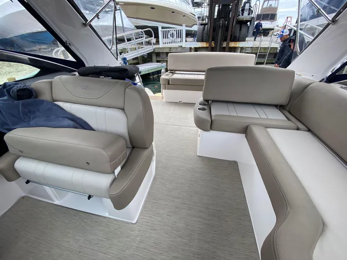  Yacht Photos Pics 2015 Regal 32 Express boat interior with beige seating and modern design.