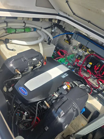  Yacht Photos Pics Engine room of a 2015 Regal 32 Express boat, showcasing dual engines and wiring.