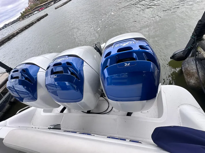  Yacht Photos Pics 2008 Donzi 38 ZSF boat with triple blue outboard engines on the water.