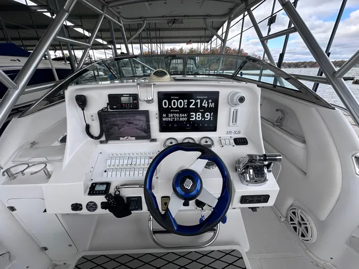  Yacht Photos Pics 2008 Donzi 38 ZSF boat dashboard with navigation equipment and steering wheel.