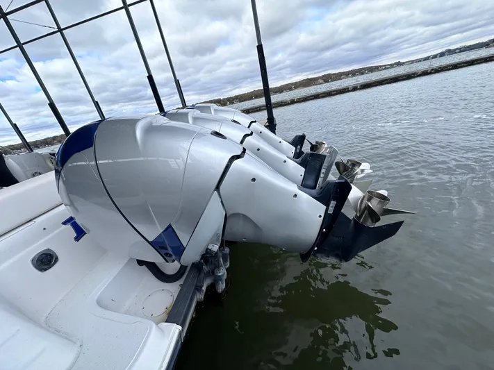  Yacht Photos Pics 2008 Donzi 38 ZSF boat with powerful outboard motors on a calm lake.