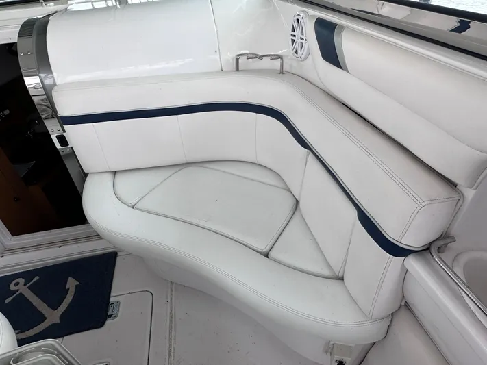  Yacht Photos Pics 2008 Donzi 38 ZSF boat interior with white cushioned seating and anchor-themed mat.