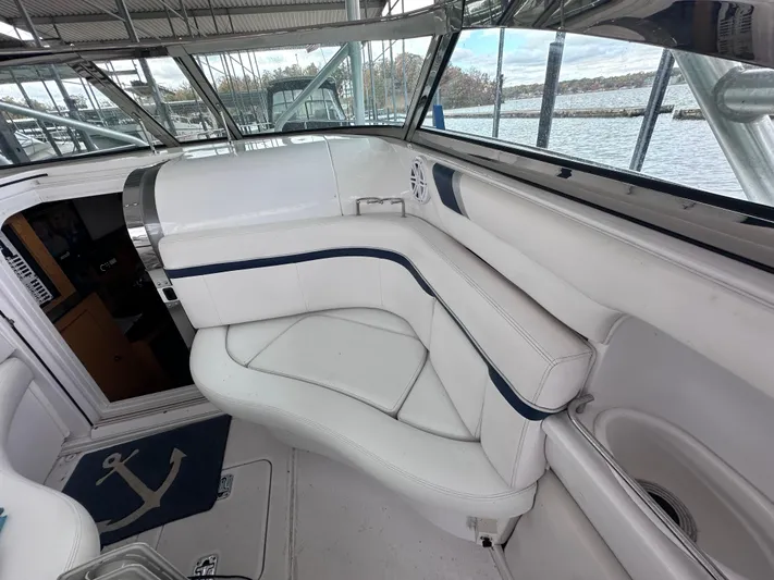  Yacht Photos Pics Interior of a 2008 Donzi 38 ZSF boat with white seating and nautical decor.