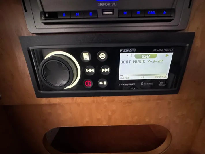  Yacht Photos Pics Fusion stereo system in 2008 Donzi 38 ZSF boat, displaying "Boat Music" on screen.