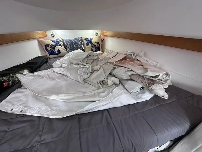  Yacht Photos Pics 2008 Donzi 38 ZSF cabin with anchor-themed pillows and folded sails on bed.