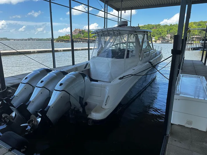 Yacht Photos Pics 2008 Donzi 38 ZSF boat docked with triple outboard engines.