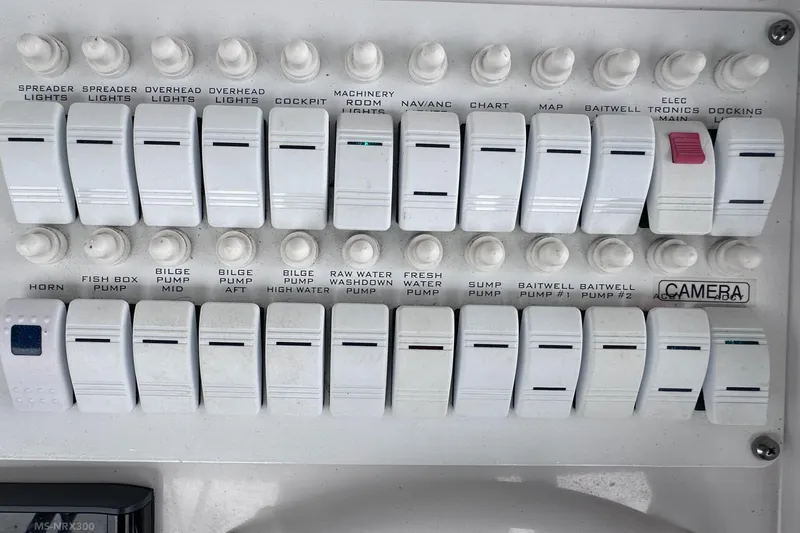  Yacht Photos Pics Control panel of a 2008 Donzi 38 ZSF boat with labeled switches and buttons.