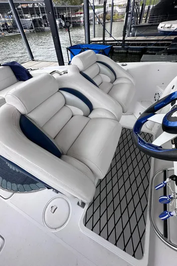  Yacht Photos Pics 2008 Donzi 38 ZSF boat interior with white leather seats and blue accents.