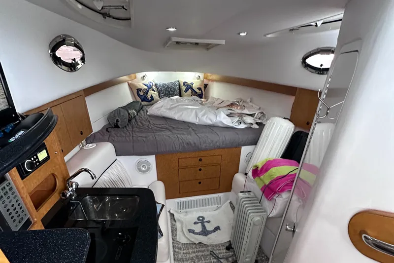  Yacht Photos Pics Interior cabin of 2008 Donzi 38 ZSF boat with bed and kitchenette.