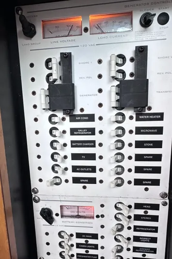  Yacht Photos Pics Control panel of a 2008 Donzi 38 ZSF boat with switches and gauges.