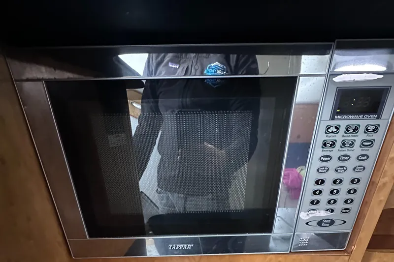  Yacht Photos Pics Stainless steel microwave oven with digital controls on a Donzi 38 ZSF boat.