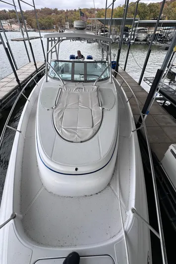  Yacht Photos Pics 2008 Donzi 38 ZSF boat docked in a marina, showcasing sleek design and spacious deck.