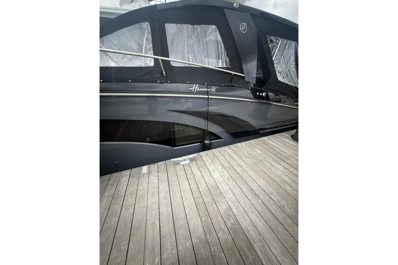  Yacht Photos Pics 2025 Hanover 447 yacht docked, featuring sleek design and modern detailing.