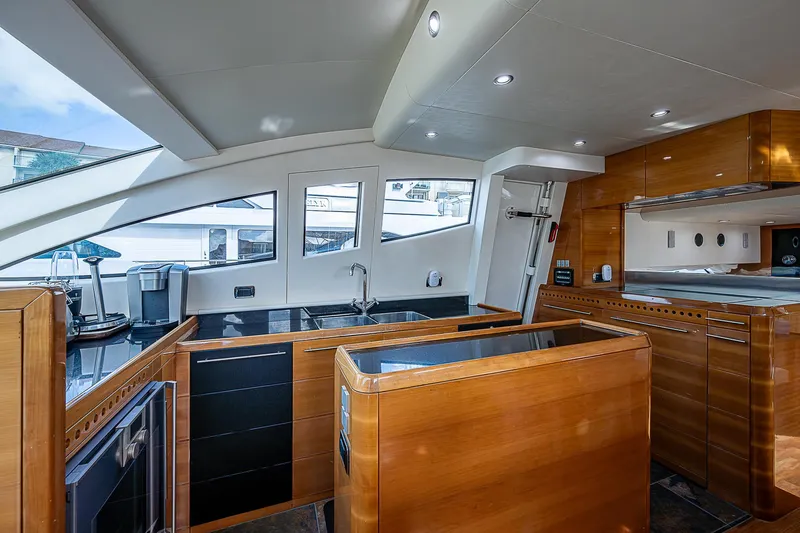 Emry Yacht Photos Pics Luxurious interior of a 2009 Aicon 64 yacht with modern kitchen design.