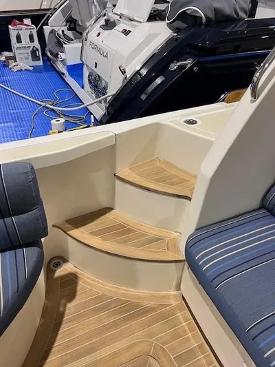 Persistence Yacht Photos Pics 2011 Sabre 40 Sedan interior with wooden steps and blue seating.