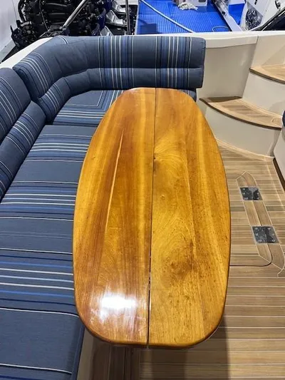 Persistence Yacht Photos Pics 2011 Sabre 40 Sedan interior with wooden table and striped seating.