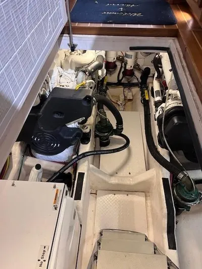 Persistence Yacht Photos Pics Engine room of a 2011 Sabre 40 Sedan boat, showcasing mechanical components.