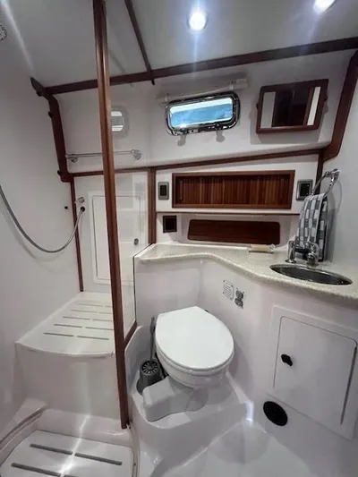 Persistence Yacht Photos Pics 2011 Sabre 40 Sedan yacht bathroom with modern fixtures and wooden accents.