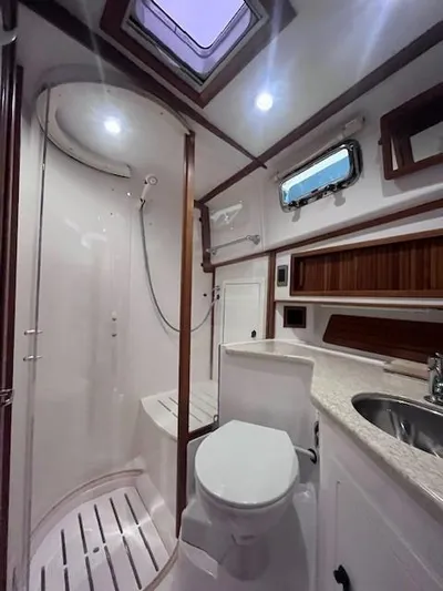 Persistence Yacht Photos Pics 2011 Sabre 40 Sedan bathroom with shower, toilet, and sink.