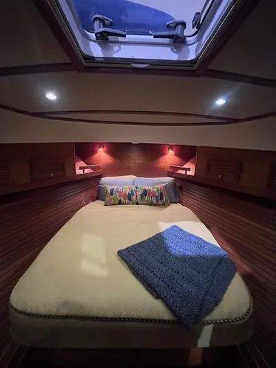 Persistence Yacht Photos Pics Cozy cabin interior of 2011 Sabre 40 Sedan with skylight and plush bedding.