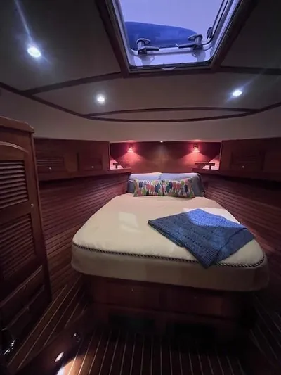 Persistence Yacht Photos Pics Luxurious cabin interior of 2011 Sabre 40 Sedan yacht with skylight and cozy bedding.