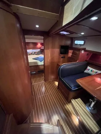 Persistence Yacht Photos Pics 2011 Sabre 40 Sedan interior with wood finish, seating area, and cozy cabin.