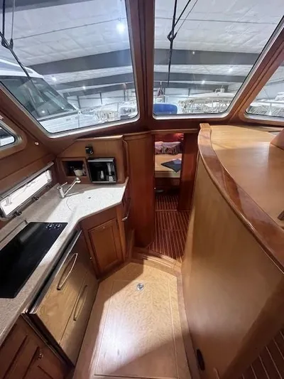 Persistence Yacht Photos Pics 2011 Sabre 40 Sedan interior with wood finish and modern kitchen amenities.