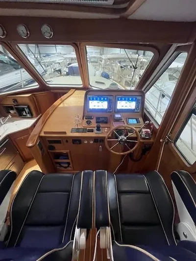 Persistence Yacht Photos Pics Interior of 2011 Sabre 40 Sedan yacht with modern navigation equipment and leather seating.