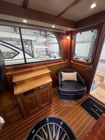 Persistence Yacht Photos Pics Interior of 2011 Sabre 40 Sedan with wood paneling and cozy seating.