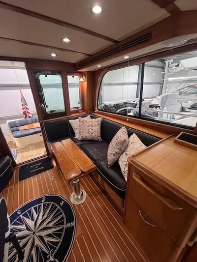 Persistence Yacht Photos Pics Interior of a 2011 Sabre 40 Sedan yacht with elegant wood finish and plush seating.