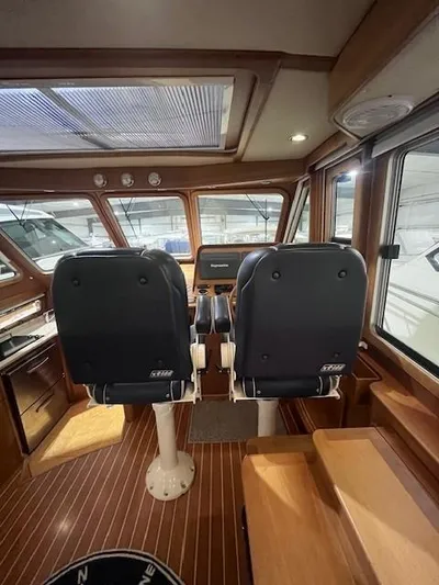 Persistence Yacht Photos Pics 2011 Sabre 40 Sedan interior with dual helm seats and wooden flooring.
